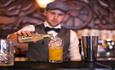 Barman pouring drinks