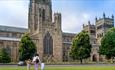 Family walking up to Durham Cathedral