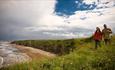 couple walking on the Durham Heritage Coast