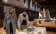 A couple looking at exhibitions inside Durham Cathedral Museum