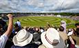 Crowds of people enjoying a cricket match at Durham Cricket's Banks Homes Riverside Stadium