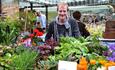 Man with flowers at Durham City Farmers' Market