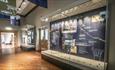 Display cabinets at World Heritage Site Visitor Centre, Palace Green Library.