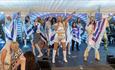 A group of singers and entertainers performing at Greek Fest
