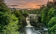 View of High Force Waterfall during sunset