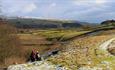 Two people walking north pennines, winter