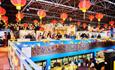 people standing under colourful lanterns as part of the Lunar New Year celebrations at Durham oriental Museum.