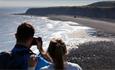 Two people looking at view across Nose's Point