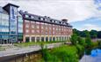 Exterior view of the Radisson Blu overlooking river.