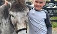 A kid and a donkey at Bonners Lodge Caravan Park