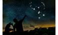 Two people looking at stars