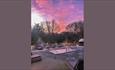 out heated jacuzzi at sunset and day beds
