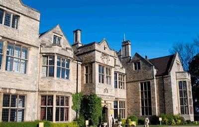 Exterior of Redworth Hall Hotel, bright blue sky.