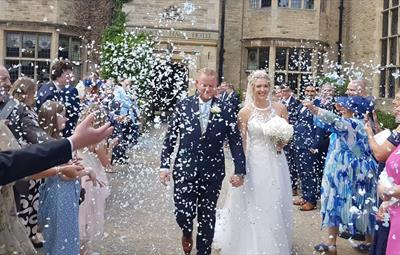 Bride and Groom laughing and smiling at Redworth Hall Hotel