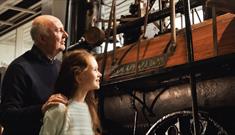 Grandad and Granddaughter looking at Locomotion