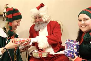 Santa and his elves exchanging gifts at Prince Bishops Place, Durham 
