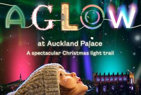 AGLOW advertising poster with a child looking up to the nights sky with AGLOW illuminated in colours