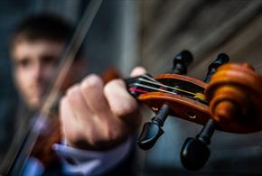 A man playing the violin