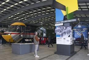 People looking at the exhibition display stand at Locomotion