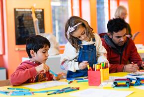 Children enjoying colouring-in their drawings. ©TheBowesMuseum