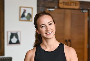 Yoga instructor smiling.