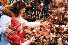 A family looking at a stall at the Beamish Hall Hotel Christmas Fair