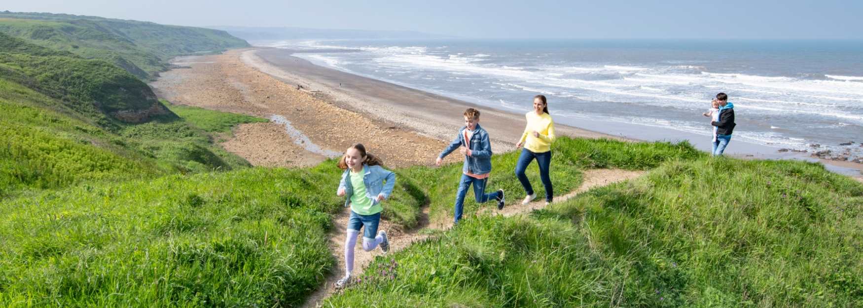 Children playing on the beach banks