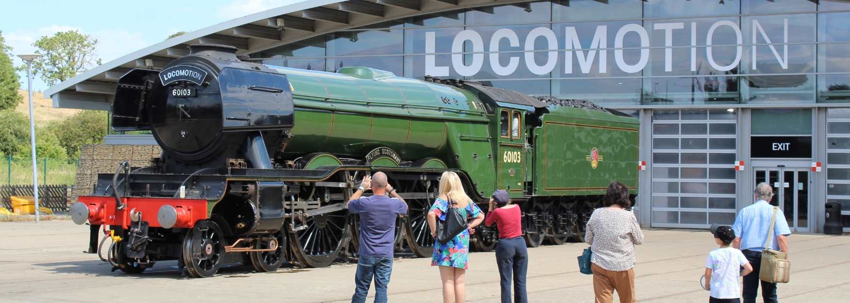 People looking at a train at Locomotion
