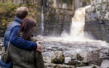 A couple standing at High Force