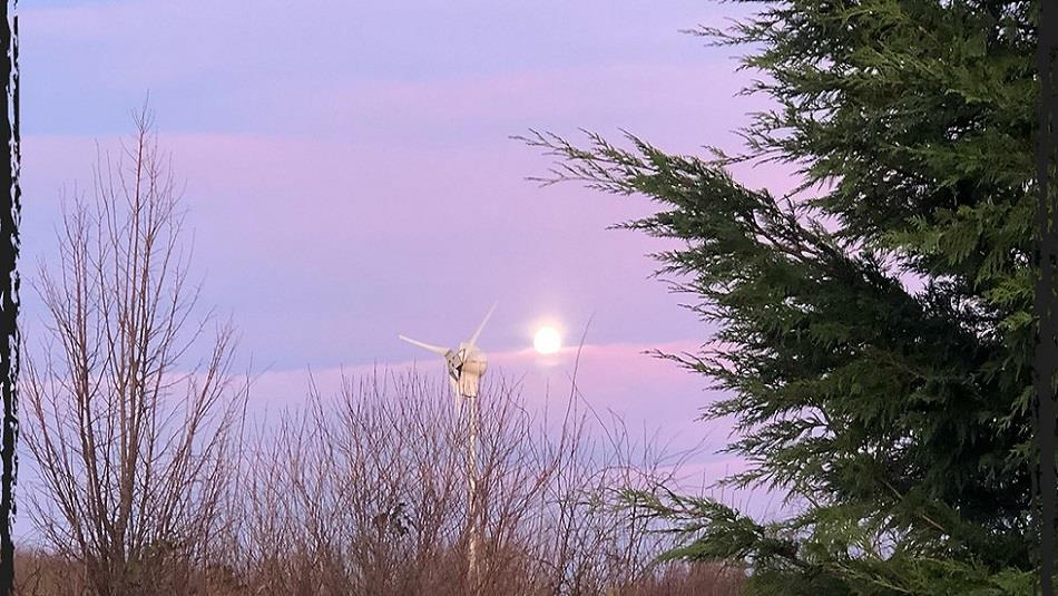 Image of the full moon in the evening sky above Dalton Moor Farm.