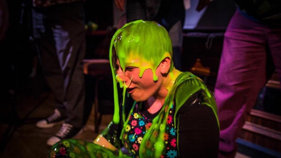 a person with green gunge poured over them