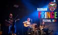 Band performing at Fringe Festival.   Fringe Festival logo and wording Durham Fringe Festival 2024