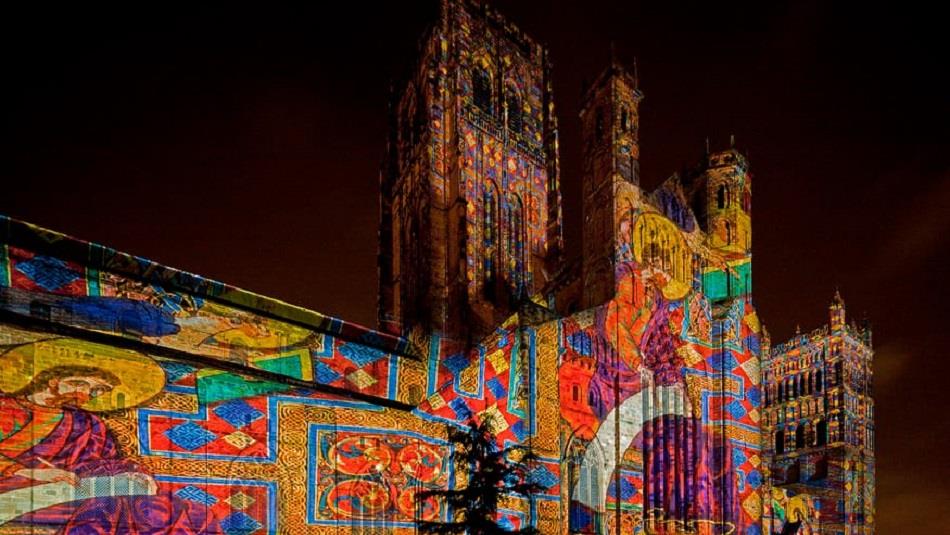 'Crown of Light' projection onto the façade of Durham Cathedral showing illuminated manuscripts from the Lindisfarne Gospels.