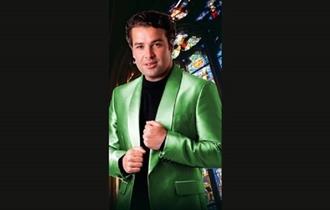 Image of Joe McElderry wearing a green jacket.