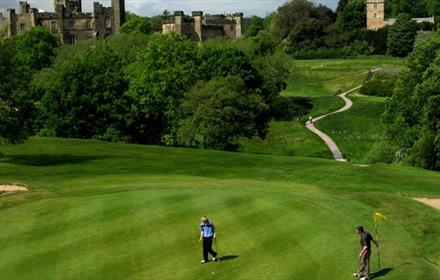 Image of people enjoying a round of golf at Brancepeth Castle Golf Course on a sunny day.