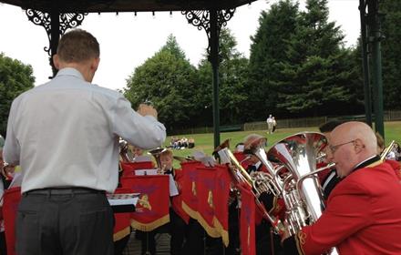 Brass band playing in bandstand at Beamish Museum.