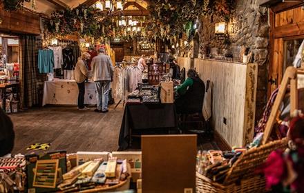 Image of people browsing Christmas Market stalls at South Causey Inn