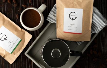 Cacao Brew sachets on a tray with a jug and  a mug