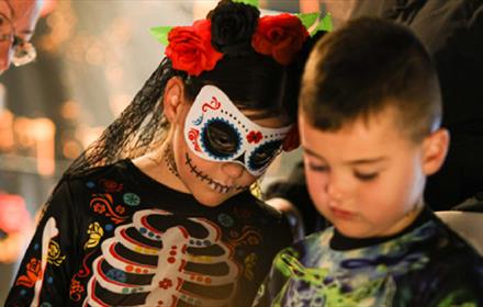 Children dressed as skeletons for Halloween.