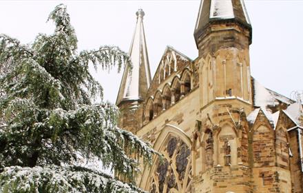 Image of a snowy Durham Cathedral exterior.