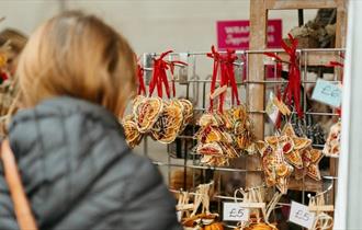 Image of someone browsing the Christmas Market at Raby