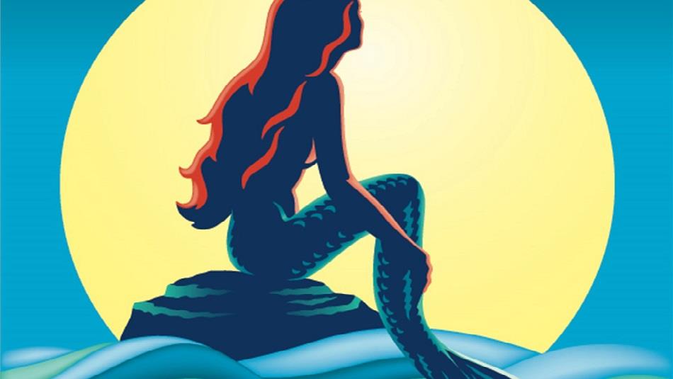 The Little Mermaid sitting on a rock at sea