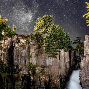 A starry sky over High Force Waterfall.  Photo by Gary Lintern