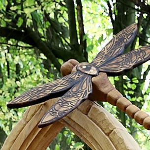 Carved wooden sculpture depicting a Dragonfly