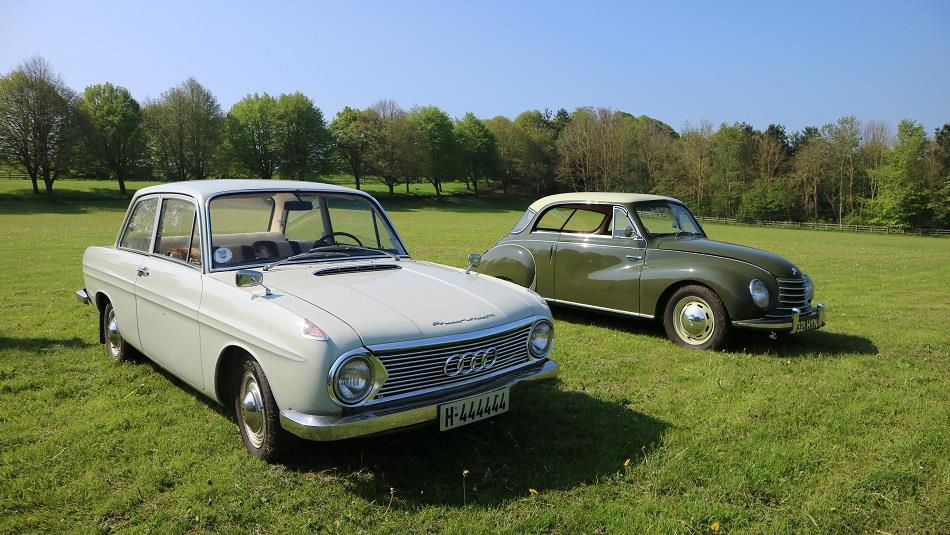 two examples of cars from a previous European Car Rally at Beamish Museum on the museum's Events Field.