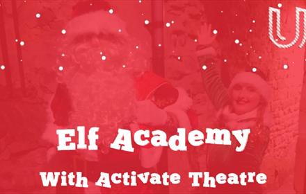 Elf Academy with Activate theatre written in white on a red background with two people dressed as Santa and an Elf.
