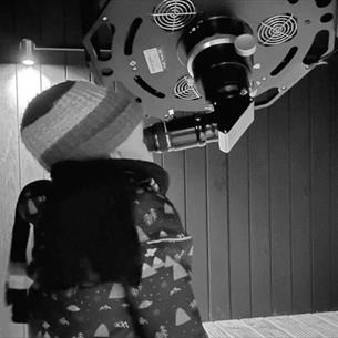 A child looking through the telescope at Grassholme Observatory