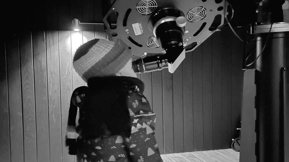 A child looking through the telescope at Grassholme Observatory A child looking through the telescope at Grassholme Observatory