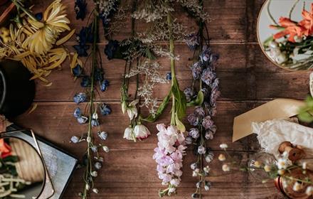 Spring Floral, a variety of flowers laid out on a wooden worktop