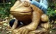 Wooden sculpture of a frog